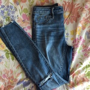 Cut knee jeans
